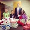 'Our Associate Michael Napuda and local Cadette Scouts were hard at work yesterday wrapping gifts to distribute to teens in the Foster Care system on behalf of the Salem County Bar Association. Thanks to our local Bar Members for your generous donations and to these Santa's Helpers for all your help!'